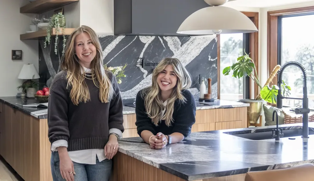 Kelly Smethills and Ann Marie Winkler at the kitchen island of their Evergreen Ranch project